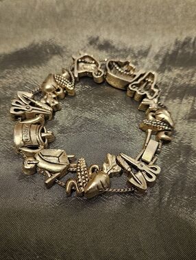 Vintage Garden Charm Bracelet in Antiqued Gold Tone.